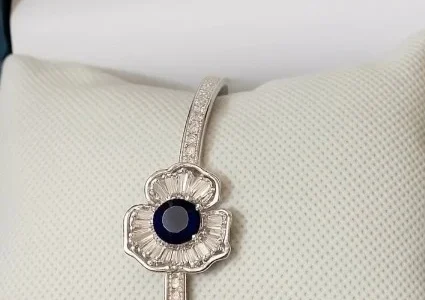 Silver bracelet with deep blue gemstone