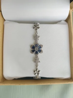 Silver bracelet with sapphire accents