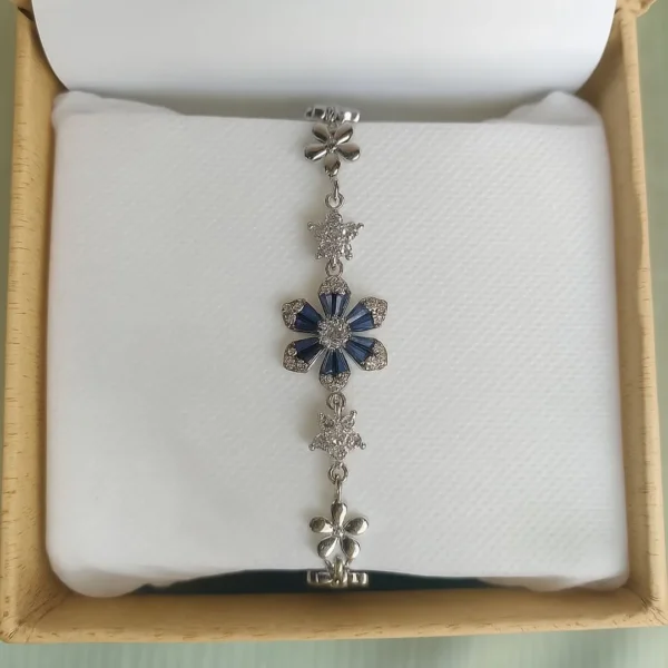 Silver bracelet with sapphire accents