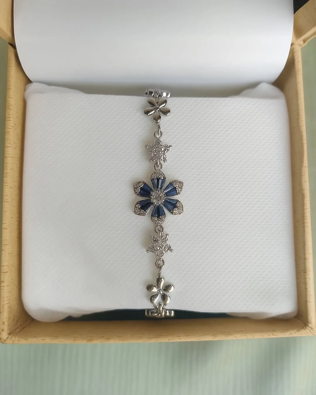 Silver bracelet with sapphire accents