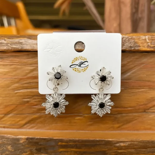 Silver hoop earrings with deep blue stones
