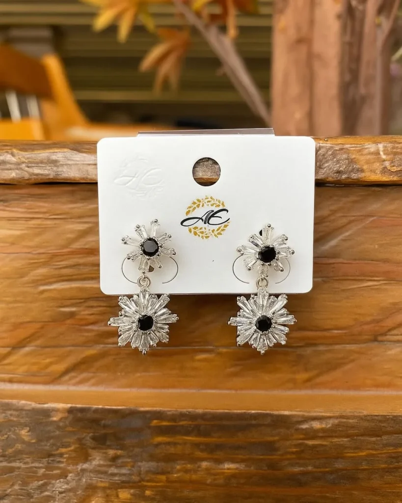 Silver hoop earrings with deep blue stones