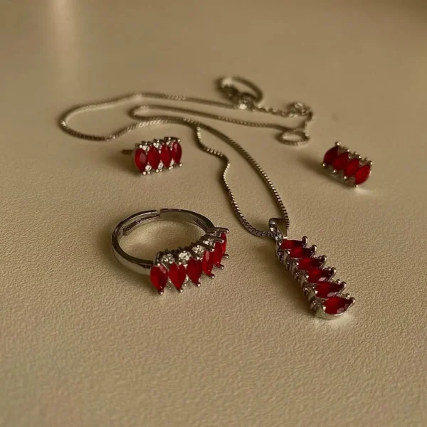 Red accent stainless steel necklace, ring, and earrings